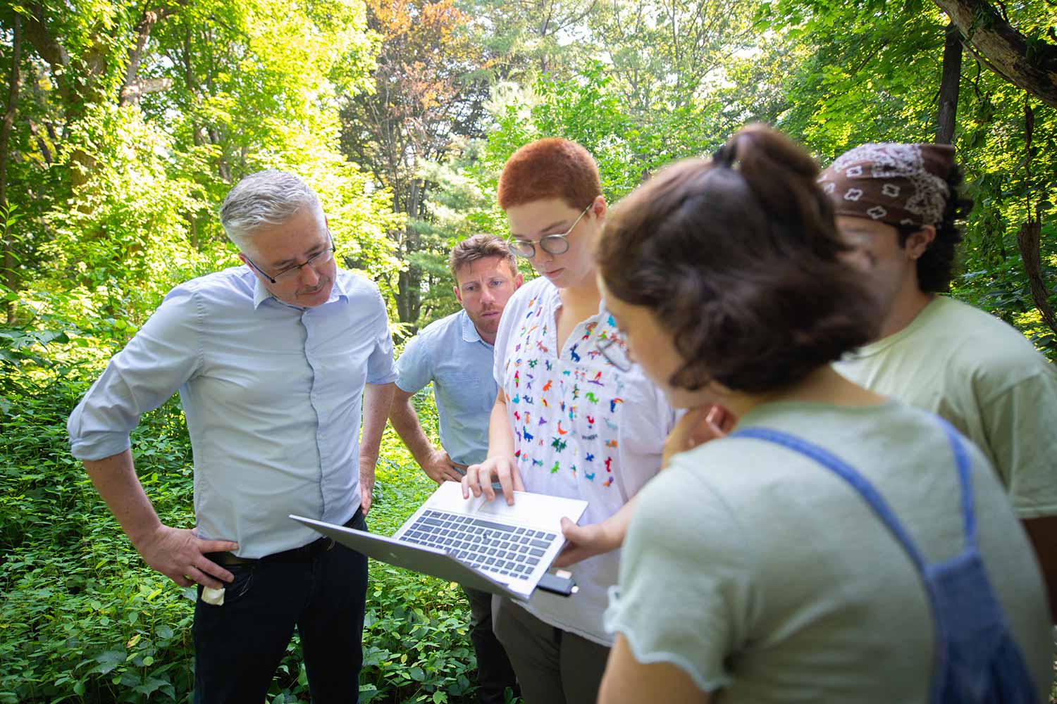 A team of researchers look at data coming from sensing equipment installed at the Hadwen Arboretum, Clark University.