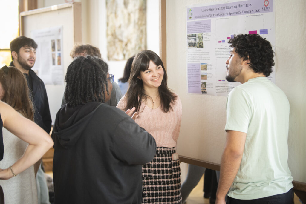 student presents poster