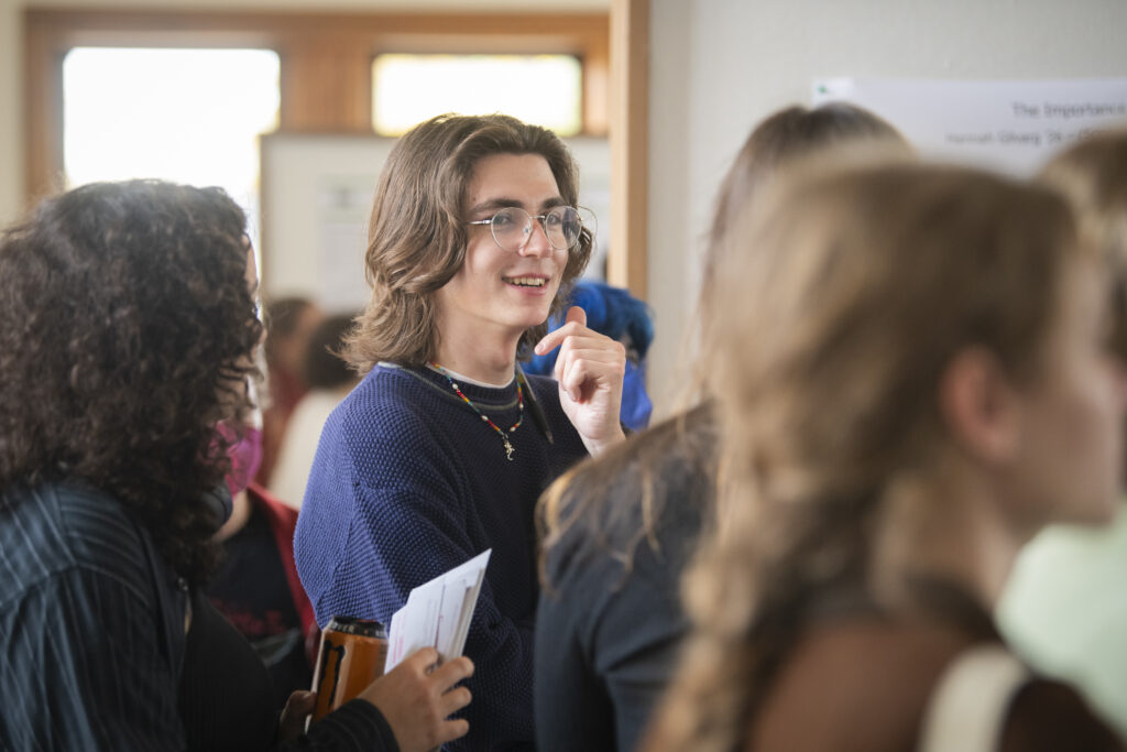 student presents poster