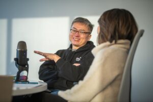 man at table with microphone