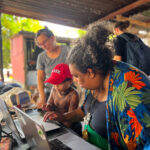 In addition to contributing to the study published in Communications Earth & Environment, Florencia Sangermano, left, partnered with members of an Indigenous community on environmental research in the Amazon as part of the XPRIZE Rainforest competition.