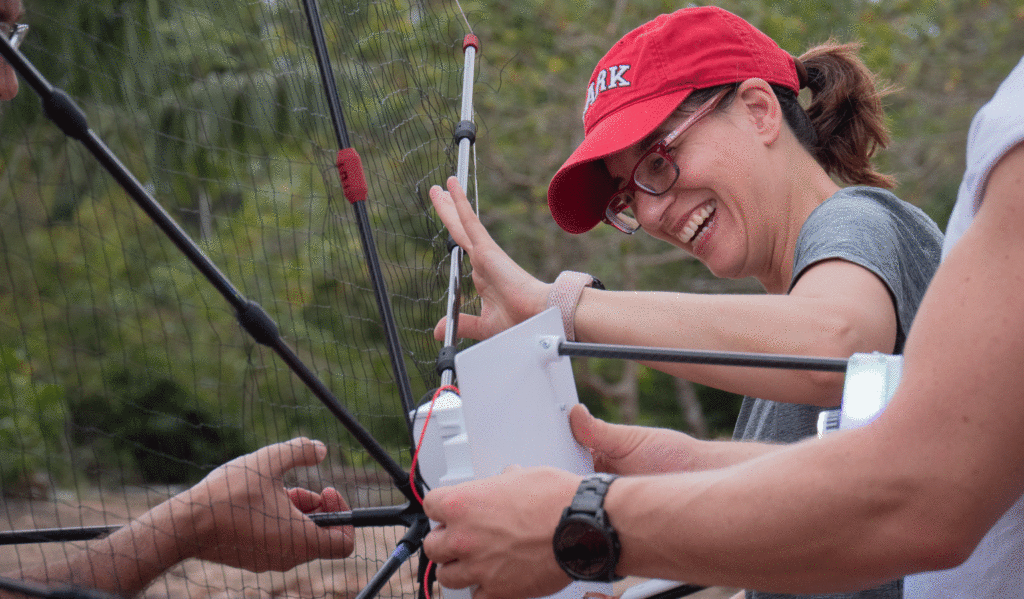 Florencia Sangermano attaches speakers to a raft carried via drone for her ecoacoustics research in the Amazon, part of the XPRIZE Rainforest competition.