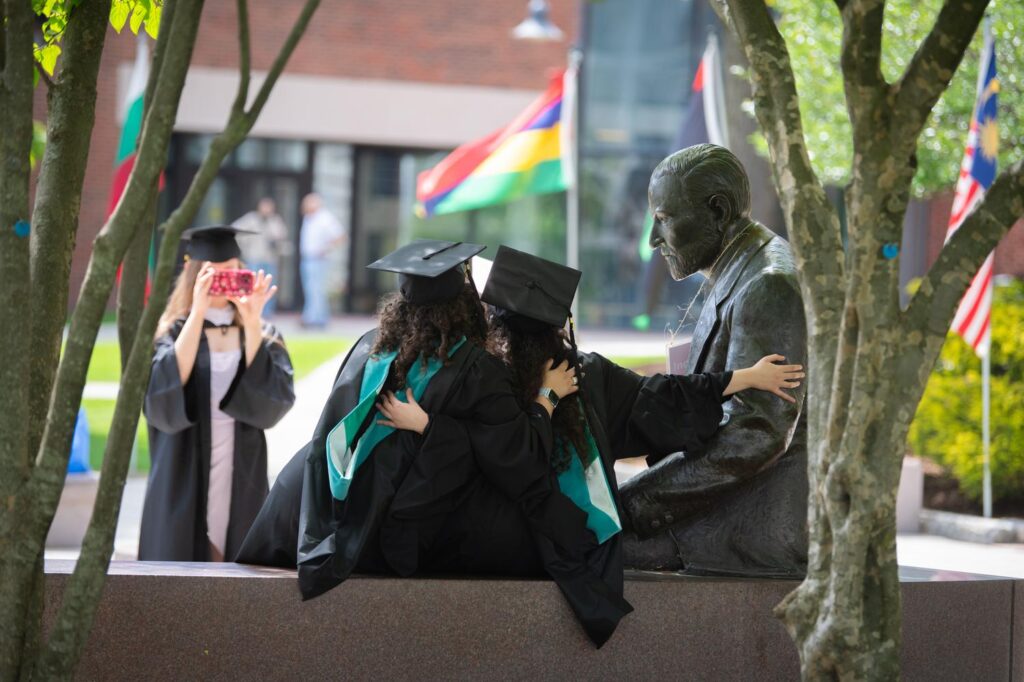 Students pose for a photo with Freud