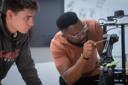 two students work in robotics lab
