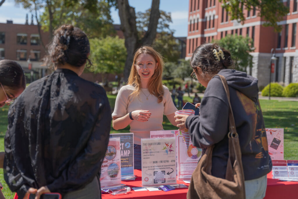 students visit table at career carnival