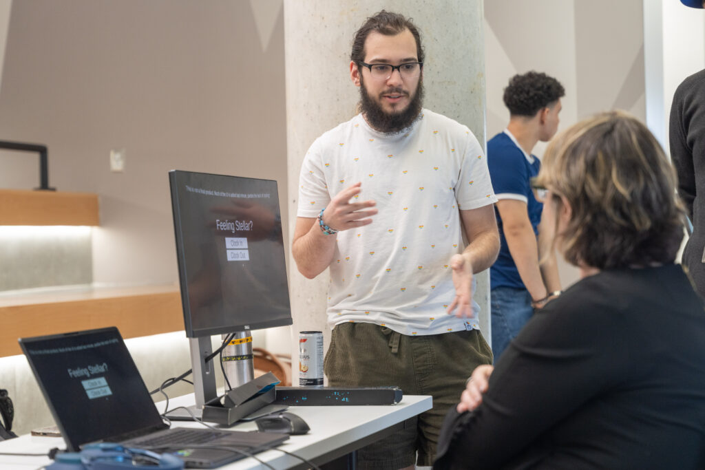 students demo video games during showcase