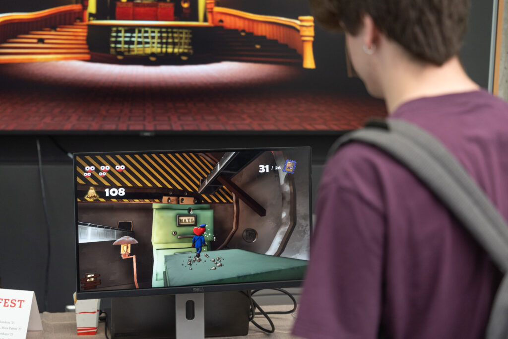 students demo video games during showcase