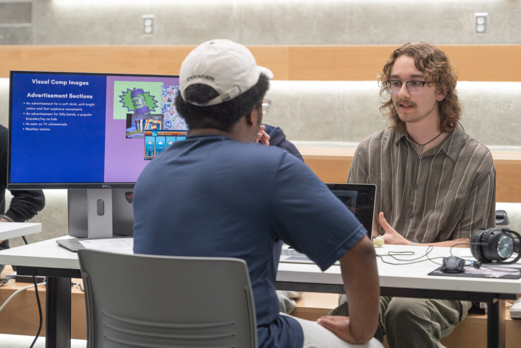 students demo video games during showcase