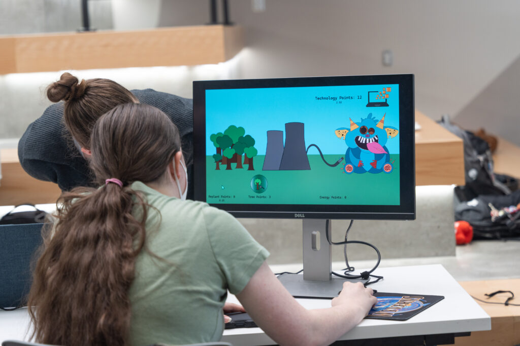 students demo video games during showcase