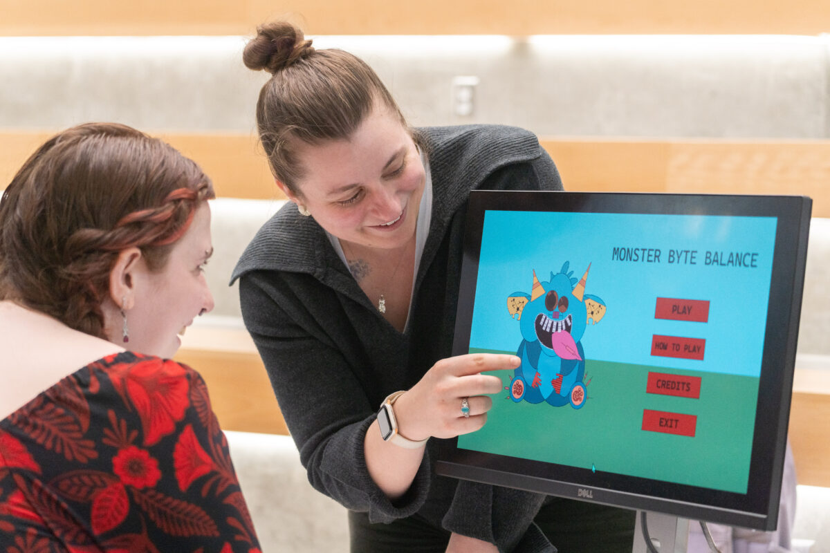 students demo video games during showcase