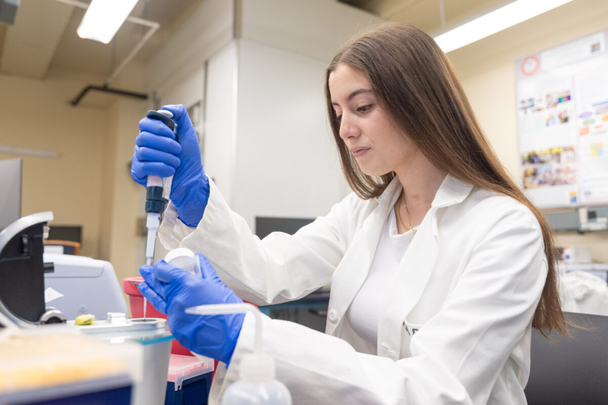 student works in science lab