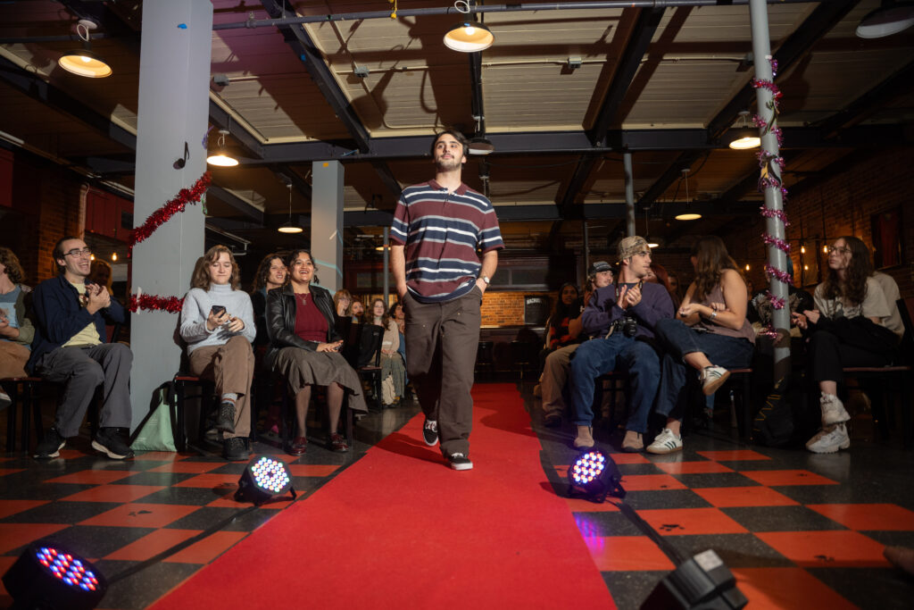 student walks in fashion show