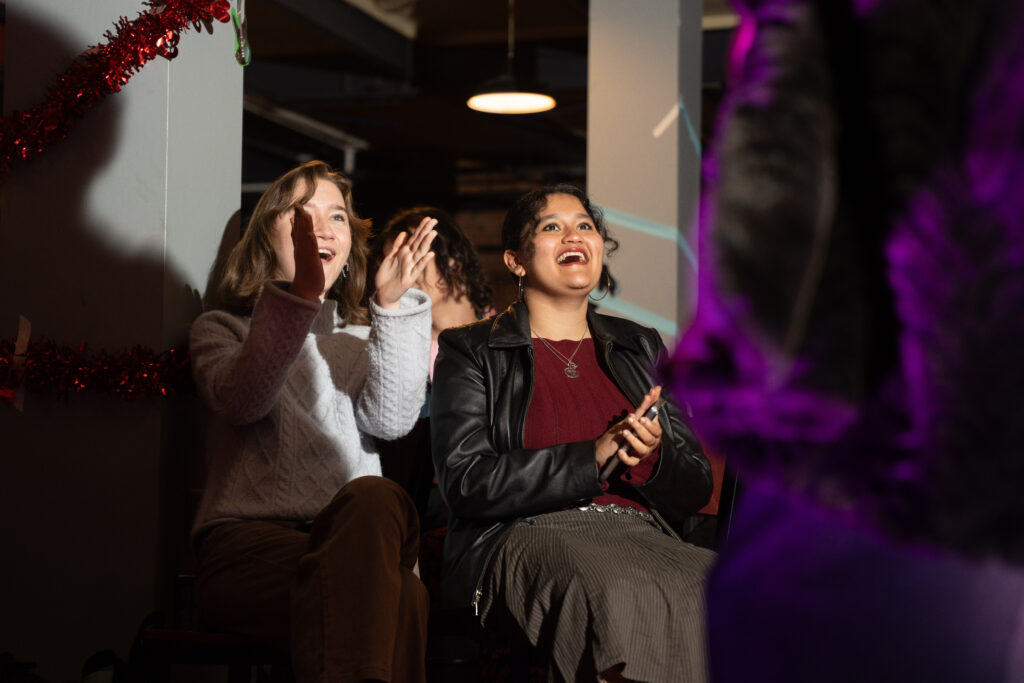 students applaud at fashion show