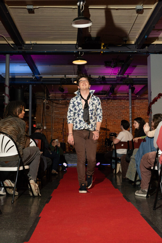 student walks in fashion show