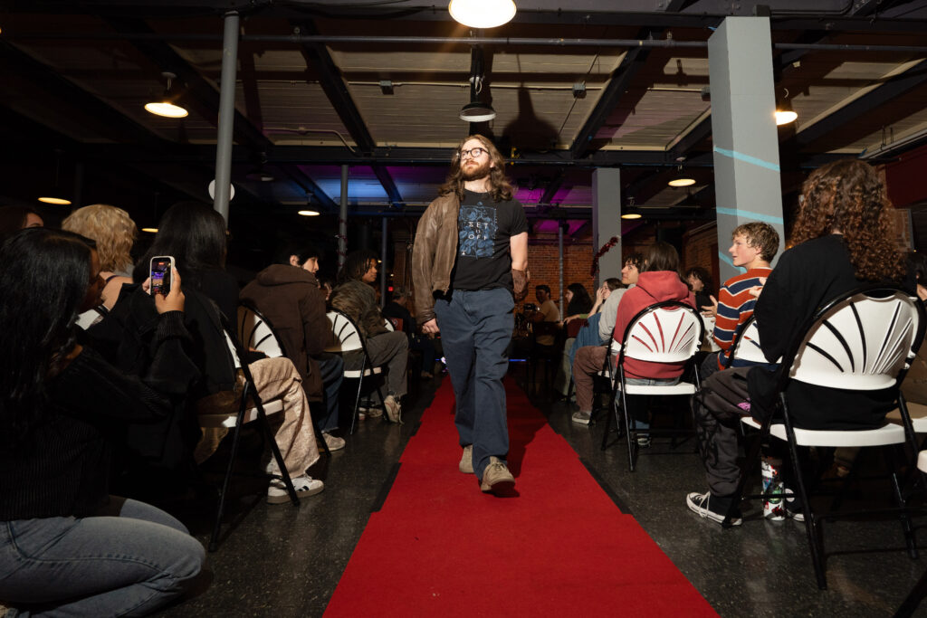student walks in fashion show