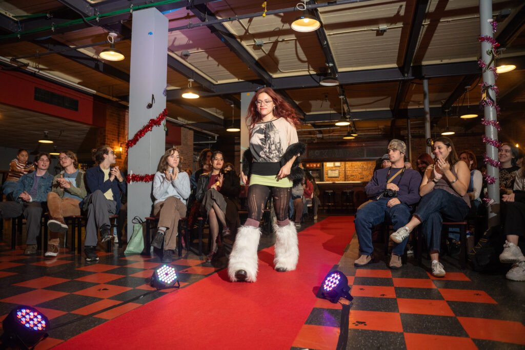 student walks in fashion show