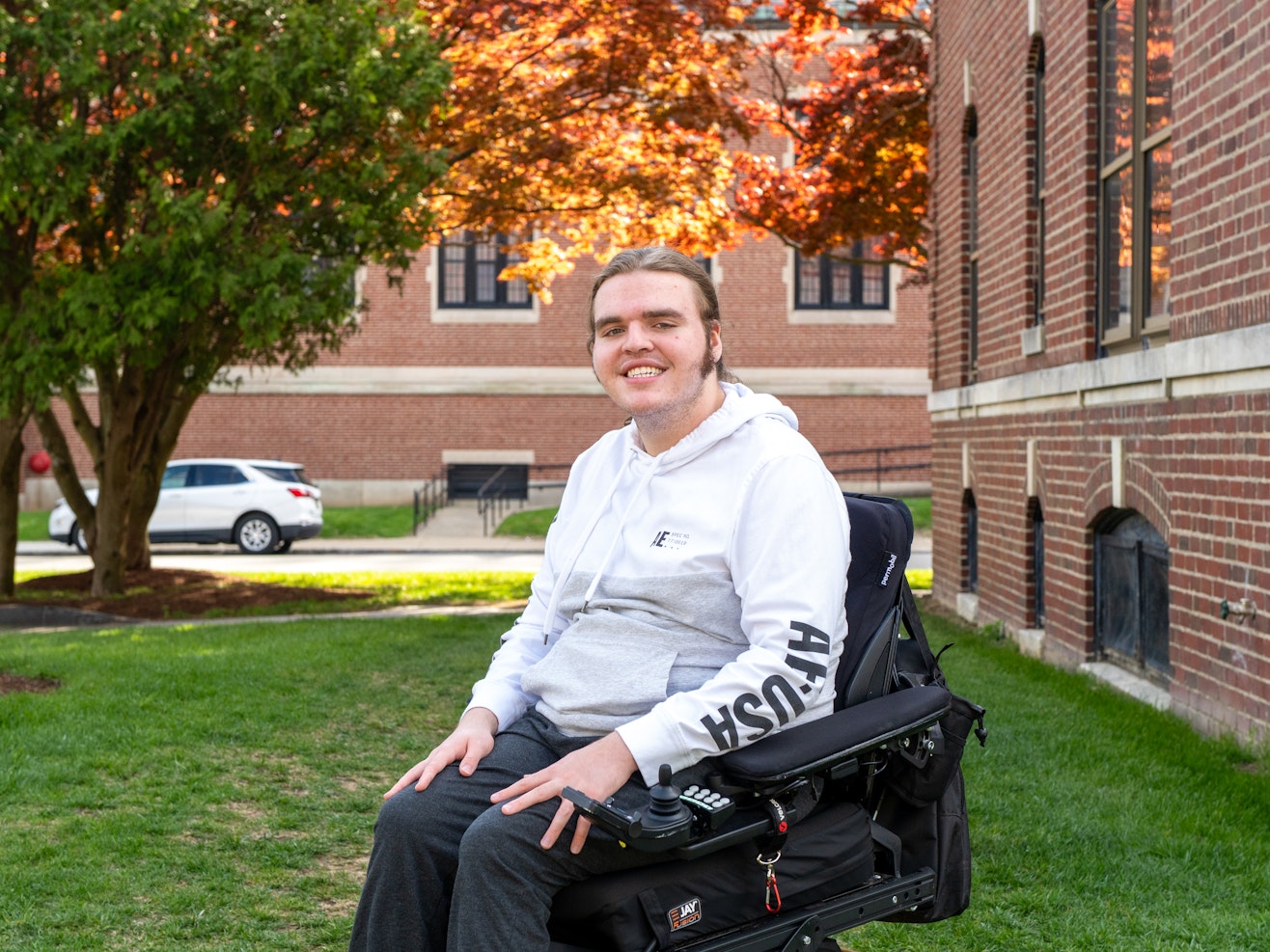 student sitting on college campus