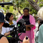 Indigenous people are interviewed at the XPRIZE competition in 2024