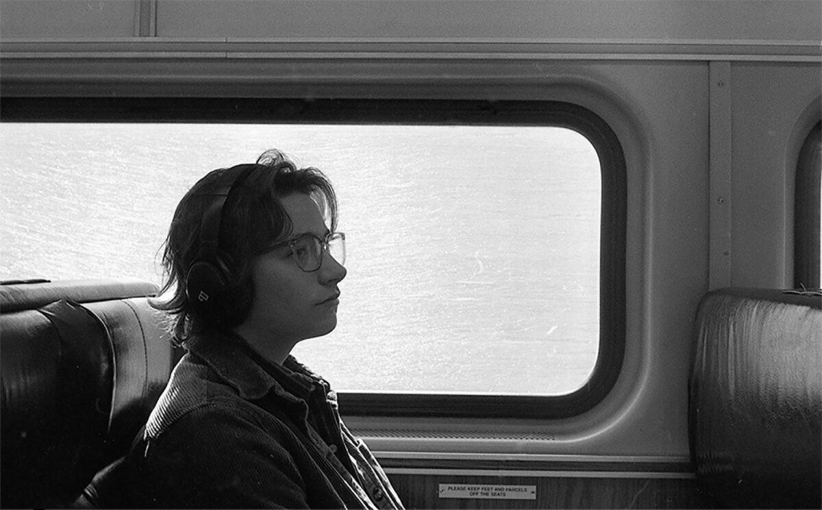 image of person sitting on train