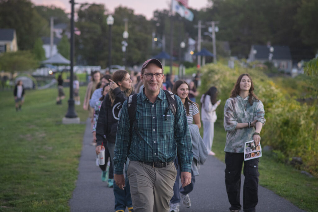 group walks on sidewalk