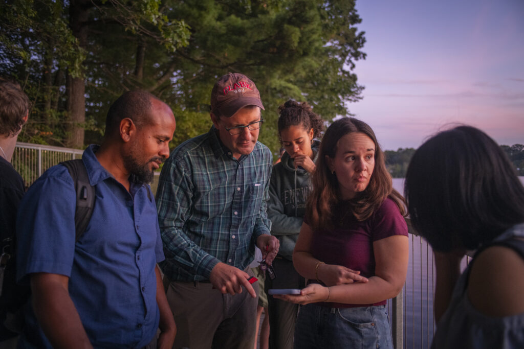 group on boardwalk at pond