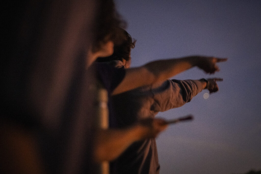 people point at pond