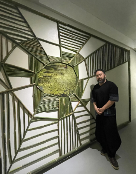 Ben Sloat with his artwork, “An encounter. Early morning. The sun.” at Project Space Pilipinas