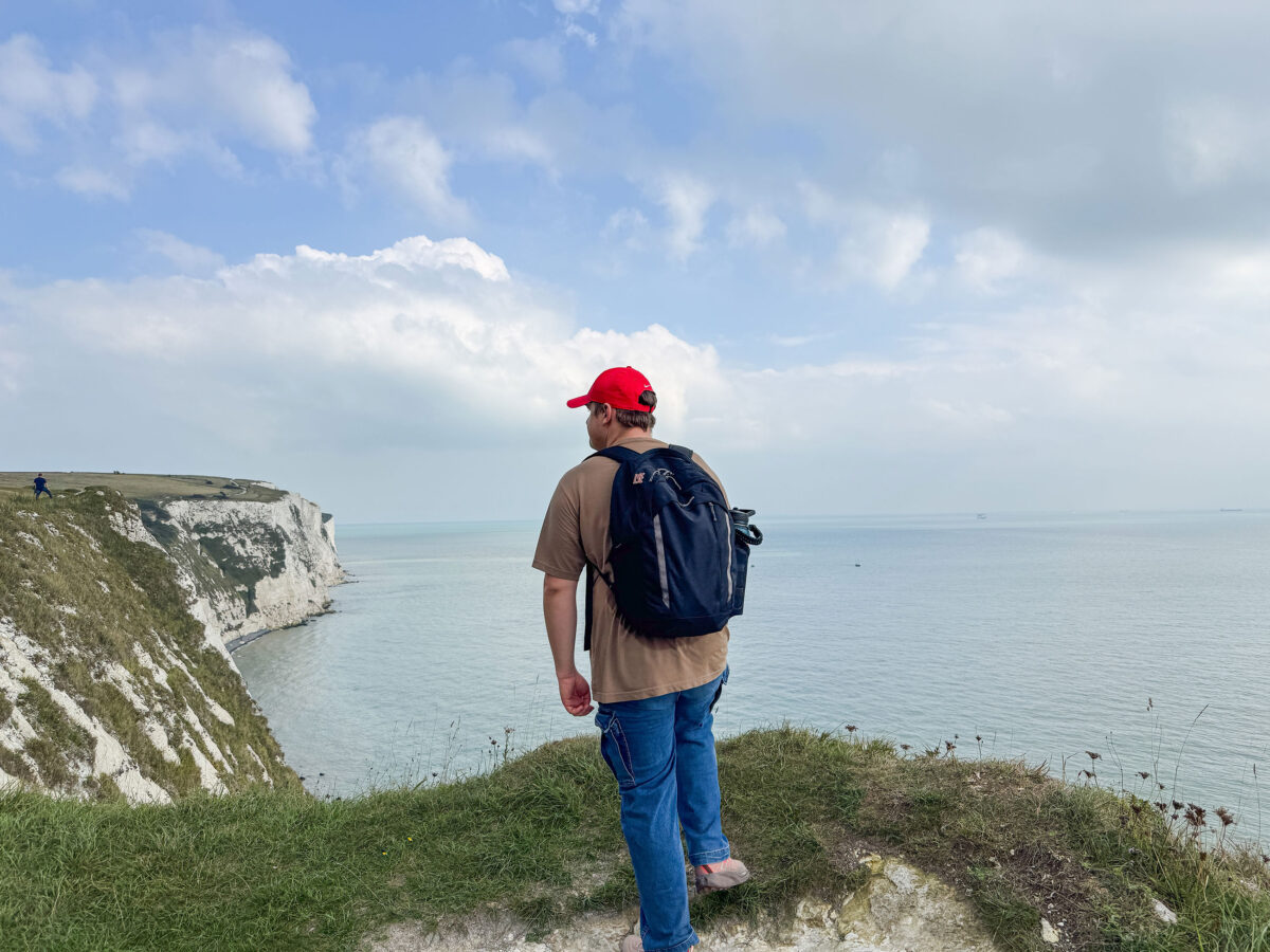 Branson Witt '27 standing above the White Cliffs of Dover, England