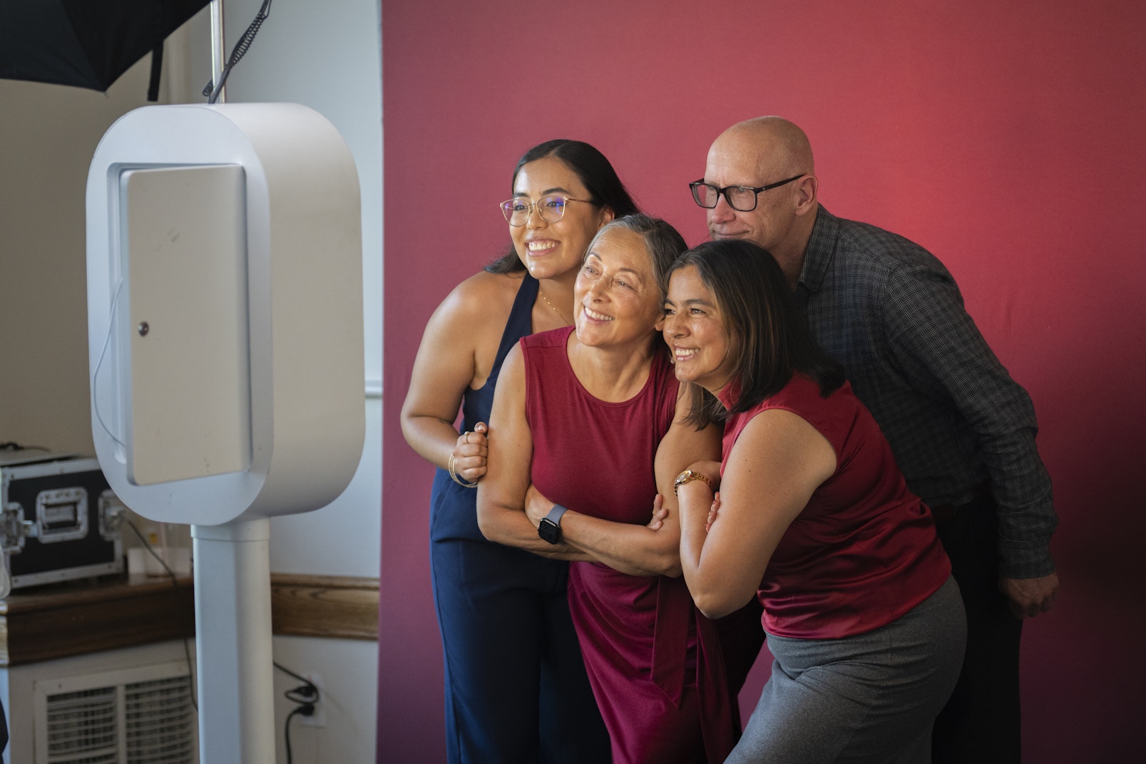 group of four poses for picture