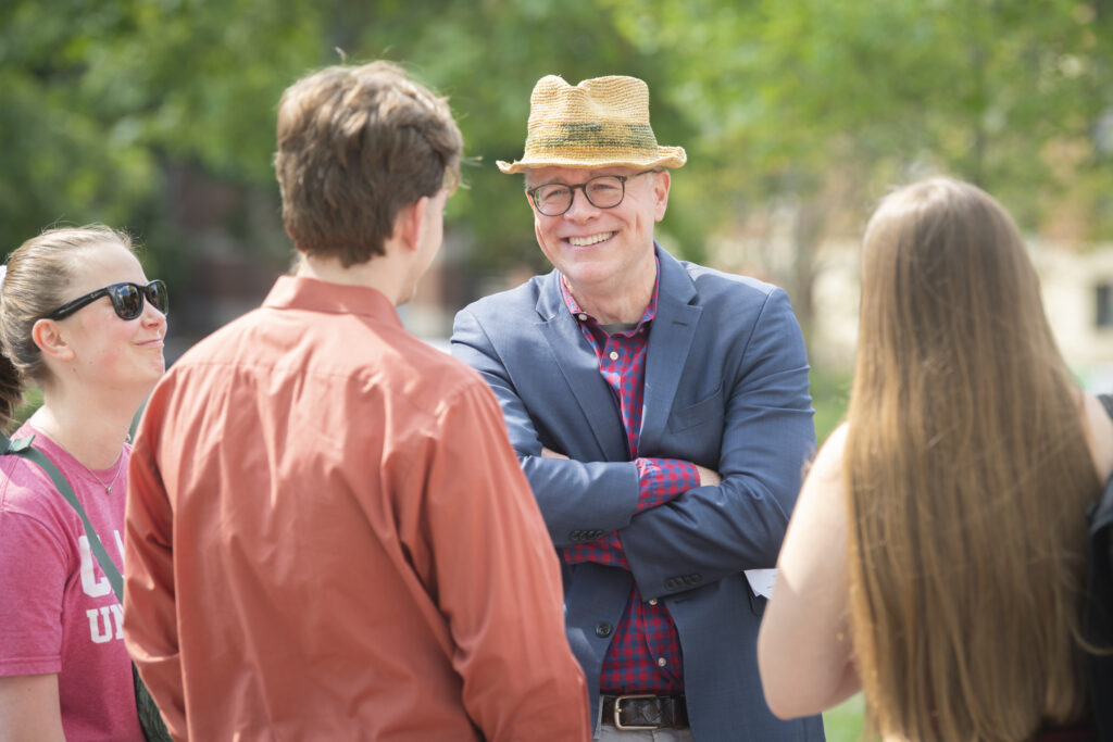 man talks to students