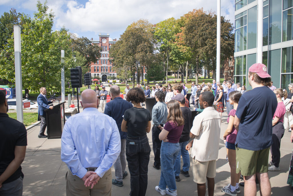 President David Fithian addresses Clark students, faculty, and staff on the patio of the Shaich Family Alumni and Student Engagement Center.