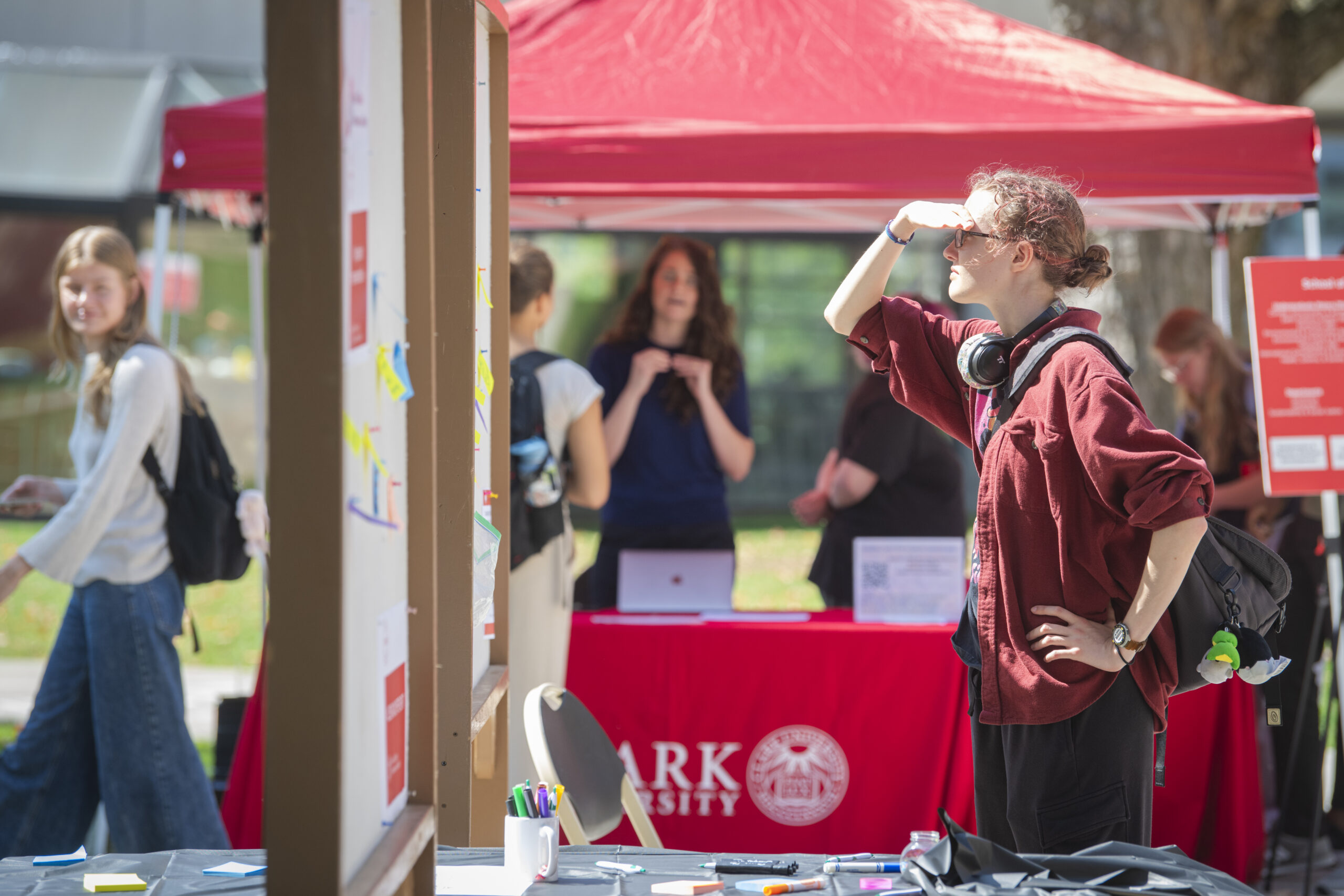 person looks at bulletin