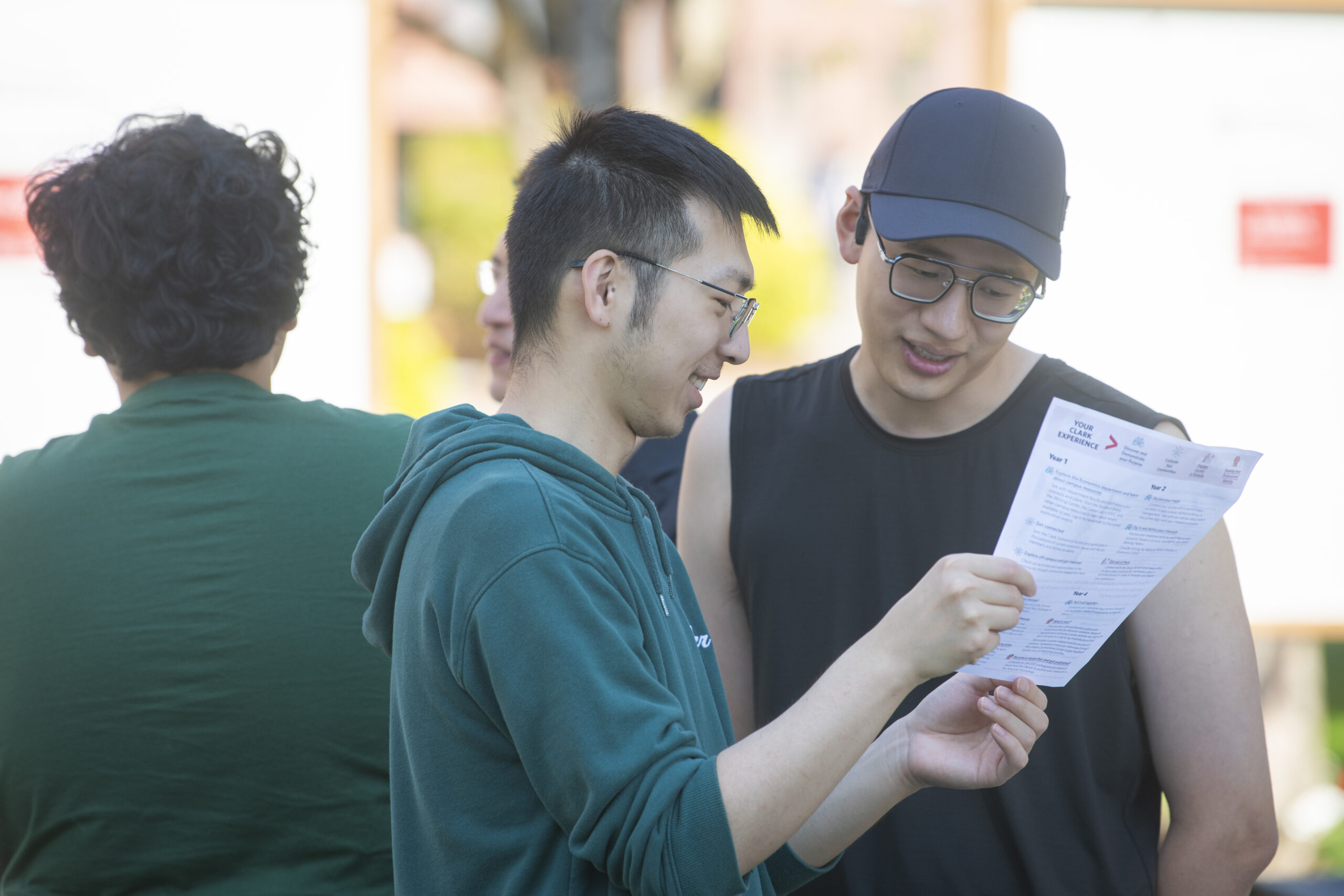 two students look at flyer