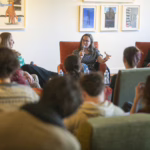 people sit in chairs for panel discussion