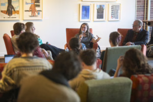 people sit in chairs for panel discussion