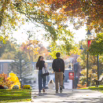 Students walking on Clark University campus in the fall