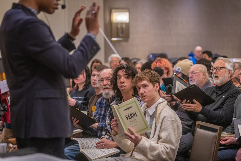 Clark University Choir rehearsing for concert at Carnegie Hall