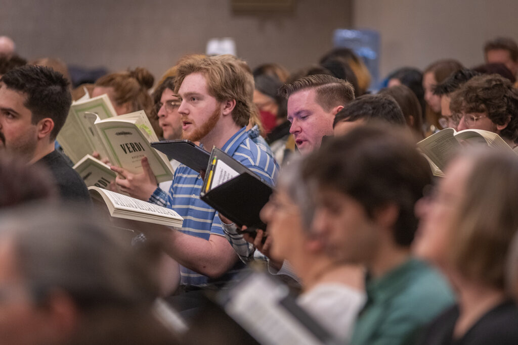 Clark University Choir rehearsing for concert at Carnegie Hall