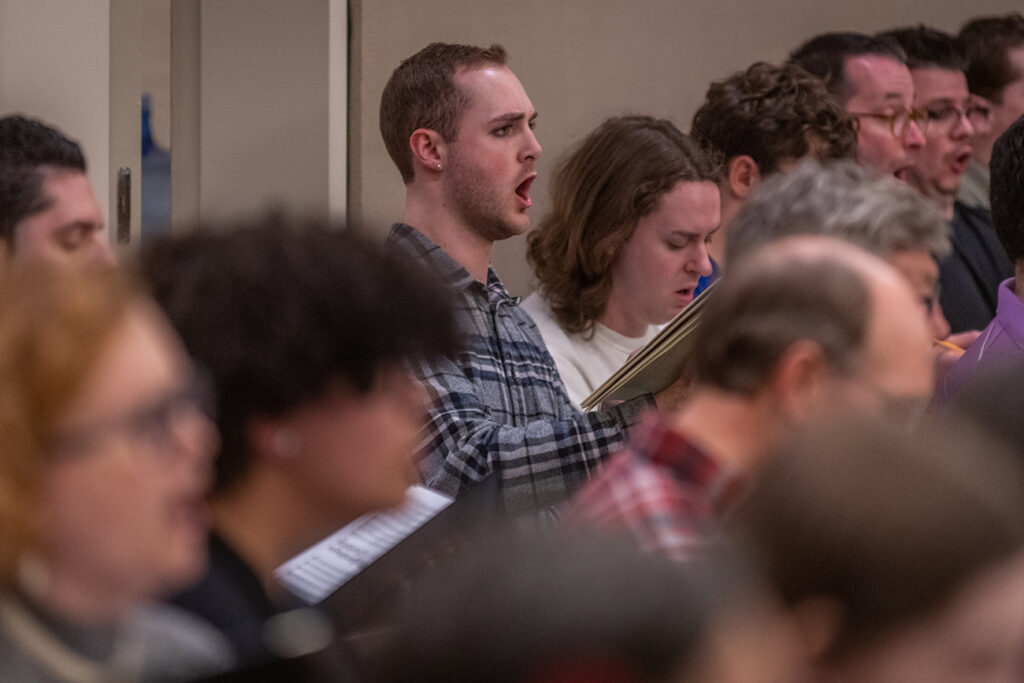 Clark University Choir rehearsing for concert at Carnegie Hall