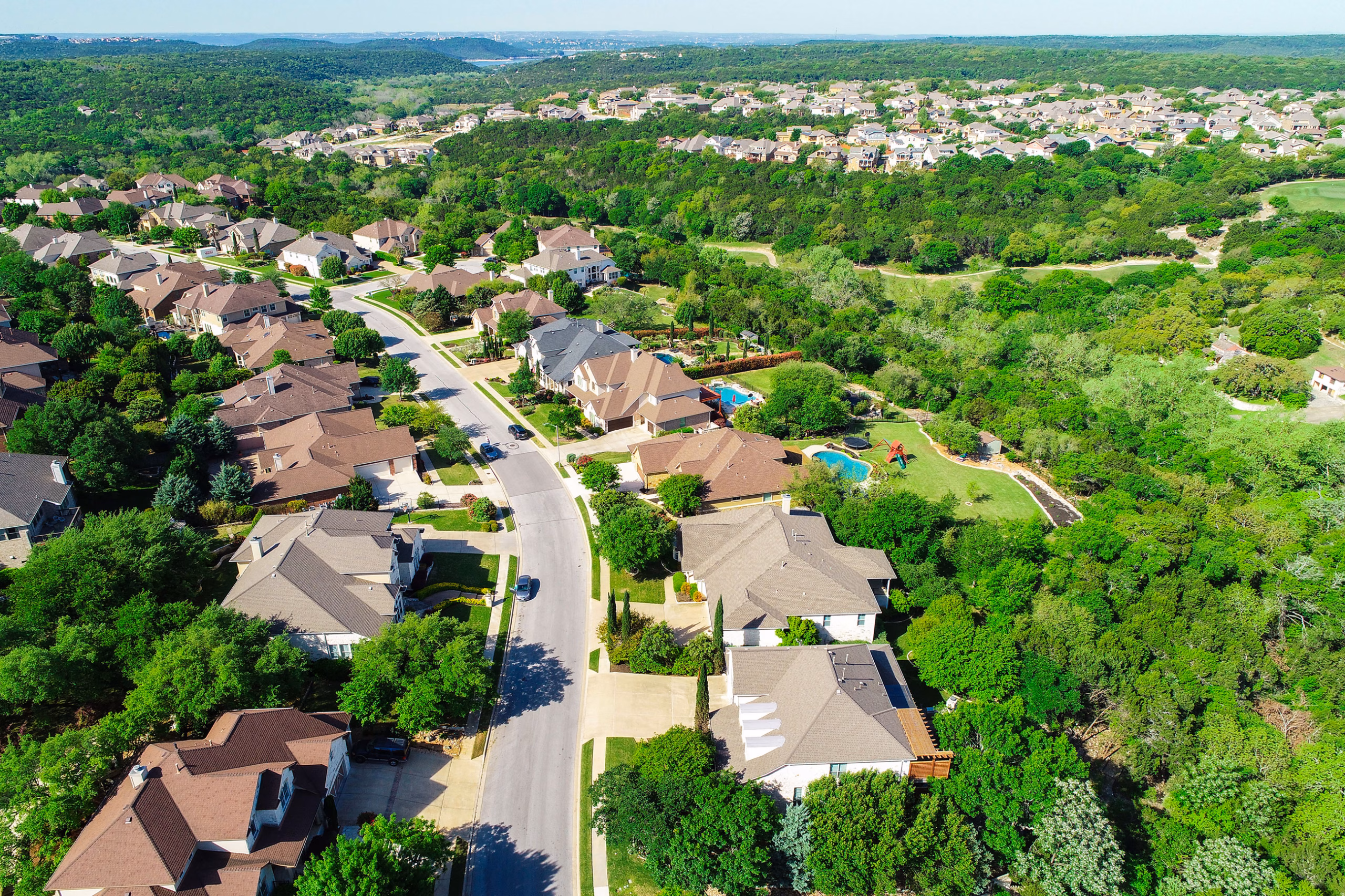 A residential development surrounded by woods and green space in Cedar Park, Texas.