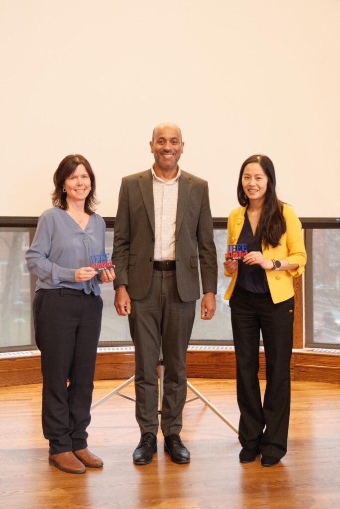 three people pose for photo