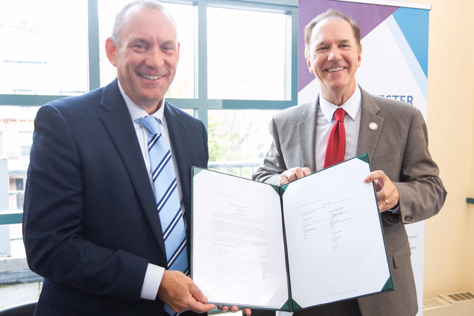 Worcester Public Schools Superintendent Brian Allen and Clark University President David Fithian hold the Memorandum of Understanding