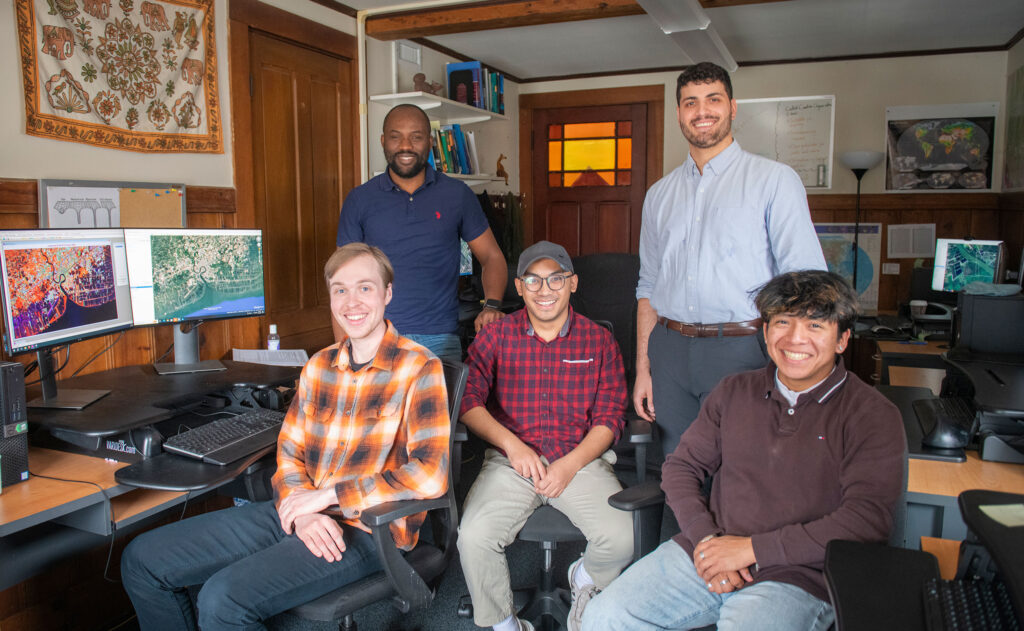 Seafood aquaculture GIS team including, from left, front, Ben Gaskill, Annan Shrestha, and Andre Bergeron; and back, Pacifique Madibi and Rishi Singh. (Photo by Steven King, University Photographer)