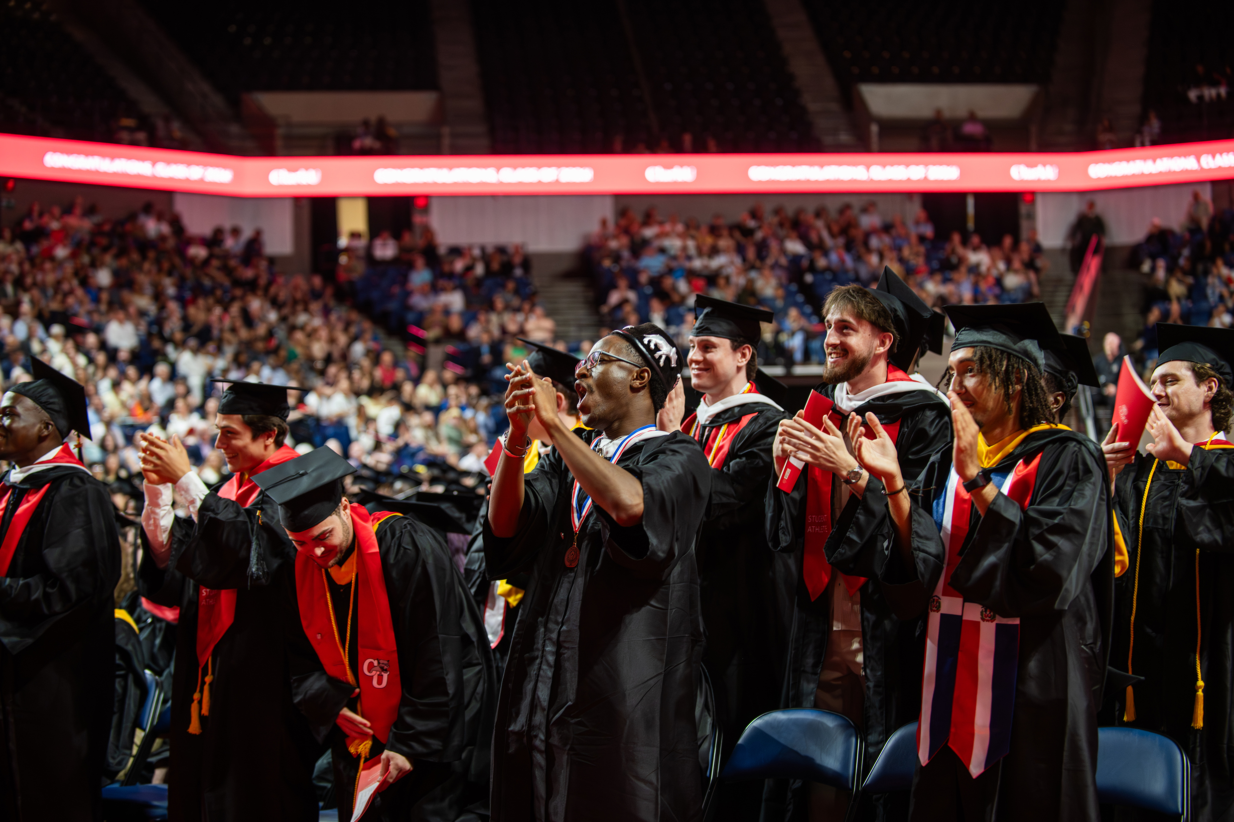 Graduating students applaud and cheer at Clark University commencement