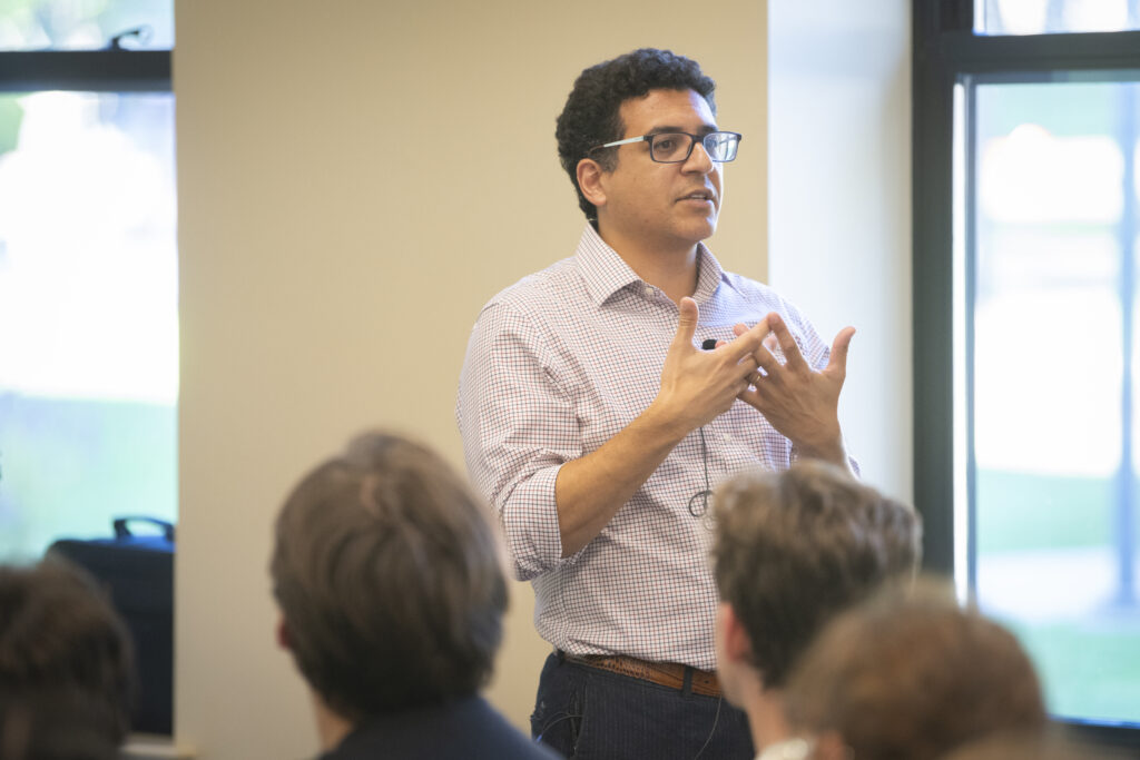 professor speaks in conference room
