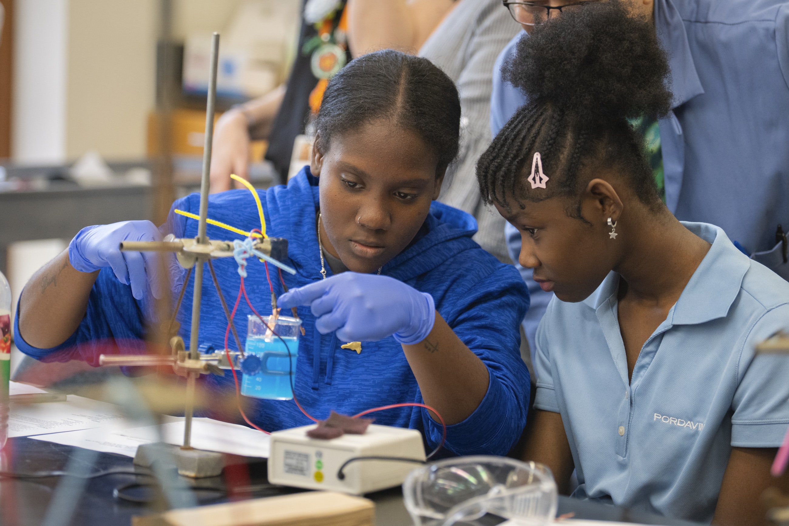 Worcester high school students conducting chemistry experiment at Clark