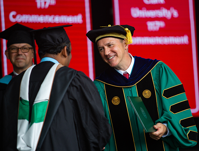 David Fithian congratulates a student