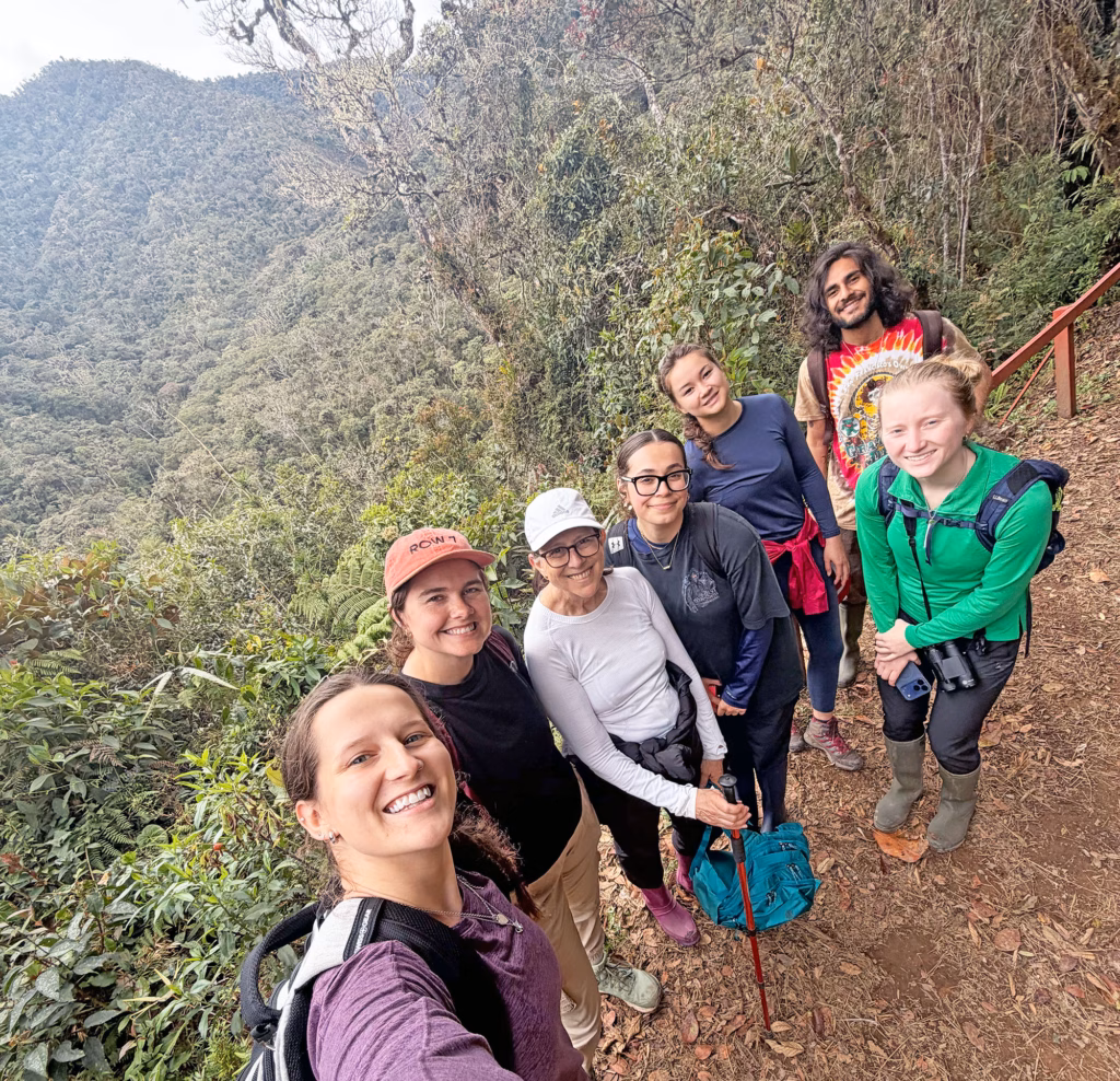 Denise Humphreys Bebbington surrounded by students on a mountain hike in Peru.