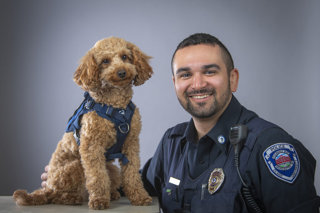Mango, a mini goldendoodle, and Detective Evan Gaylord