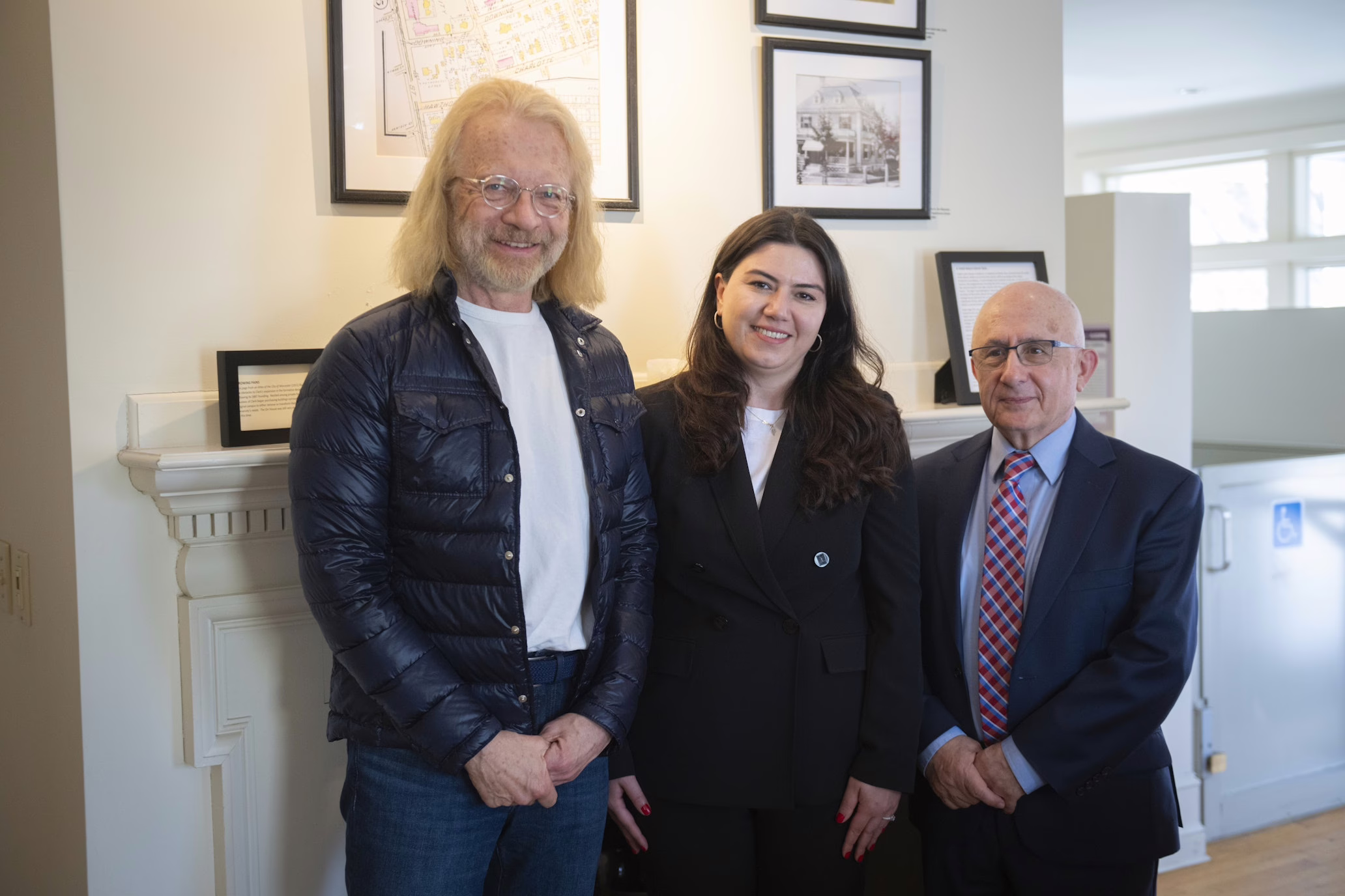 three people pose for photo
